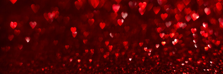 Wall Mural - Red hearts, sparkling glitter bokeh background banner, valentines day abstract defocused texture header.