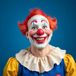 © Gerald - Portrait of happy clown on blue background, space for text