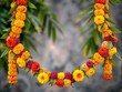 © figi - Vibrant marigold garland on a blurred green background, symbolizing celebration and tradition. Generative AI