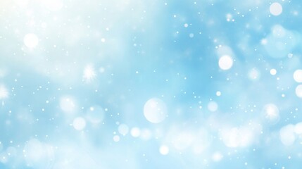 abstract light blue bokeh background with bright sparkles and glowing particles.