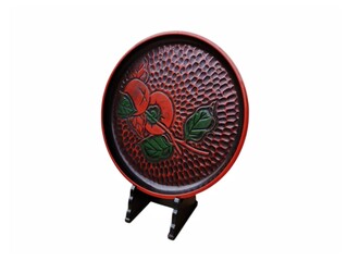 Wall Mural - The white background in the picture is a carved wooden plate with a pattern of small and large grooves mixed together with an image of two red-orange persimmons placed on a display stand.