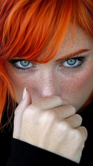 Poster - A close up of a woman with red hair and blue eyes