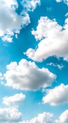 Wall Mural - A blue sky with white clouds in the middle of it