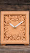© SJ Studio - Secondhand shop, antique & vintage concept. Wooden clock with intricate floral carvings, showcasing craftsmanship and design elegance.