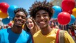 © yeni prihandini - Happy diverse teens smiling at camera with balloons.