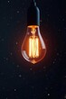 © Yasotaro - Softly glowing filament suspended in mid-air against a dark background, filament, soft illumination