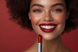 © Denis - Smiling woman with bold red lips showcasing lipstick in a vibrant studio setting during the afternoon