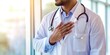 © ArenaPics - Man in a white coat is holding his chest