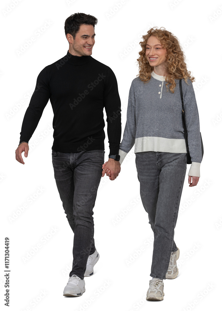 Happy young couple walking hand in hand and smiling isolated on ...