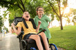 © ADDICTIVE STOCK - Joyful moment between children friends with disabilities in a park