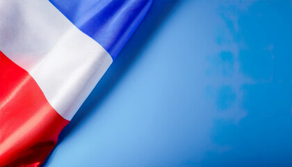 Canvas Print - Close-up of the French tricolor flag with vibrant blue, white, and red stripes, set against a plain blue background.