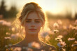 © Bojan - Woman surrounded by wildflowers at sunset in a serene outdoor setting