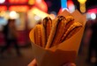 © Vladyslav - Delightful Churros Drizzled With Chocolate Create a Sweet Treat at Night Festival