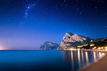 Wall Mural - Beautiful night sky with a large body of water and mountains in the background