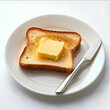 © emrenmaw - plate of toast with butter on top and a spread knife lying next to sit white background The image is photorealistic taken with a 35mm lens at f20 resulting in a highres