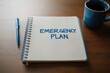 © ibnu - Preparedness in action with an emergency plan notebook and essentials on a desk