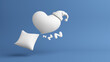 © chawalit - White pillow with heart and woolen hat bedroom time snooze dream night morning sleep and drowsiness on blue background. Deep and happy sleep. Copy space. Object with clipping path. 3D Illustration.