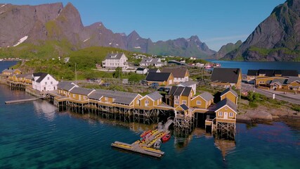 Wall Mural - nestled along the coast, this vibrant village in norway showcases charming wooden structures perched