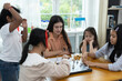 © eakgrungenerd - children playing chess board game education strategy classroom. Training for brain development.