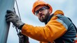 © khonkangrua - Construction worker focused on safety while performing tasks outdoors in a professional helmet and gloves