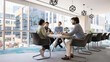 © fizkes - Multiethnic business team discussing collaboration, partnership, planning strategy, brainstorming on project together, talking at large table in modern meeting room interior. Banner shot