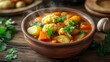 © Pro Creator - A vibrant vegetable curry with golden potatoes, orange cauliflower florets, and rich tomato sauce, garnished with fresh cilantro, served in a rustic terracotta bowl, exuding warmth and comfort