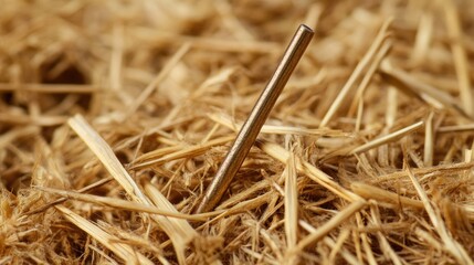 Abstract representation of finding a needle in a haystack with a painted nail emerging from straw symbolizing challenges in discovery