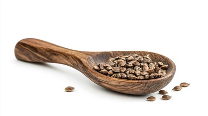 Overturned wooden spoon filled with seeds isolated on a clean white background showcasing natural textures and organic materials