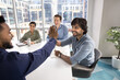 © fizkes - Happy diverse business colleagues making high five gesture at successful meeting, joining hands, smiling, laughing, feeling excited about project success, corporate teamwork, creative brainstorming