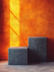 A minimalist interior featuring two geometric blocks against a warm orange wall.