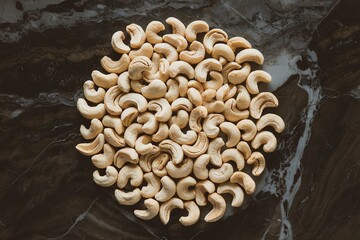 A photo of cashew nuts isolated on a marble background