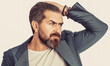 © Yevhen - Bearded man, stylish hairstyle, beard. Male beard and mustache. Elegant man in business suit. Male in tuxedo
