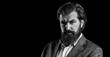 © Yevhen - Portrait of the handsome man with long beard and moustache. The man's beard was thick and well-groomed. Beard bristled. Bearded brutal hipster man. Elegant man in business suit. Black and white