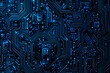 © Abstract - Abstract close-up of a glowing blue digital circuit board, showcasing intricate connections and technological design on a black background.