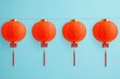 © Arfa_Media - Four red chinese lanterns hanging on a string creating festive ambiance