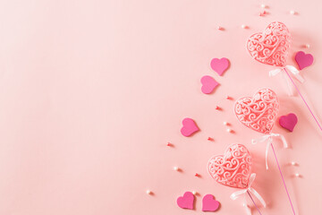 Wall Mural - Pink hearts on a light pink background