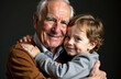 © algae5 - Elderly caucasian male and young caucasian child embracing with joyful expressions