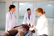 © krongthip - Doctors rush injured patient to emergency room.