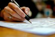 © Uliana - employee writing notes on financial records, vibrant and professional task setting