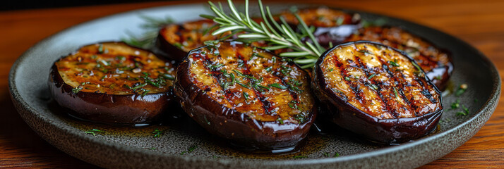 Poster - Grilled eggplant rounds on a modern plate with a drizzle of olive oil and fresh rosemary sprigs,