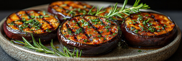 Poster - Grilled eggplant rounds on a modern plate with a drizzle of olive oil and fresh rosemary sprigs,