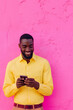 © Василь Тігай - Smiling Man with Smartphone Against Pink Wall