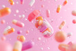 © Mahmud - Colorful Capsules and Pills Floating on Pink Background
