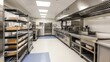 © gentho - Modern commercial kitchen with stainless steel equipment and organized workspace.