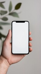 Wall Mural - hand holding a modern smartphone with a blank white screen, perfect for showcasing mobile apps, webs