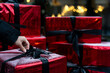 © RooM The Agency - Close-up of a woman unwrapping a Christmas gift box