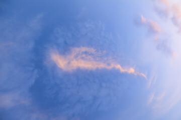 Wall Mural - A beautiful sky tinted by the sun leaving vibrant shades of gold, pink, blue and multicolored. Clouds in the twilight evening and morning sky. Cloudy sky background in the evening, and during the day.