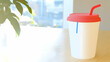 © LAILY - Refreshing drink in disposable cup on wooden table near window, city view background. Ideal for cafe, beverage promotion.