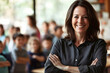 © antusher - Smiling female teacher standing in a classroom with students