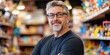 © Brian - toy store owner standing in his small business